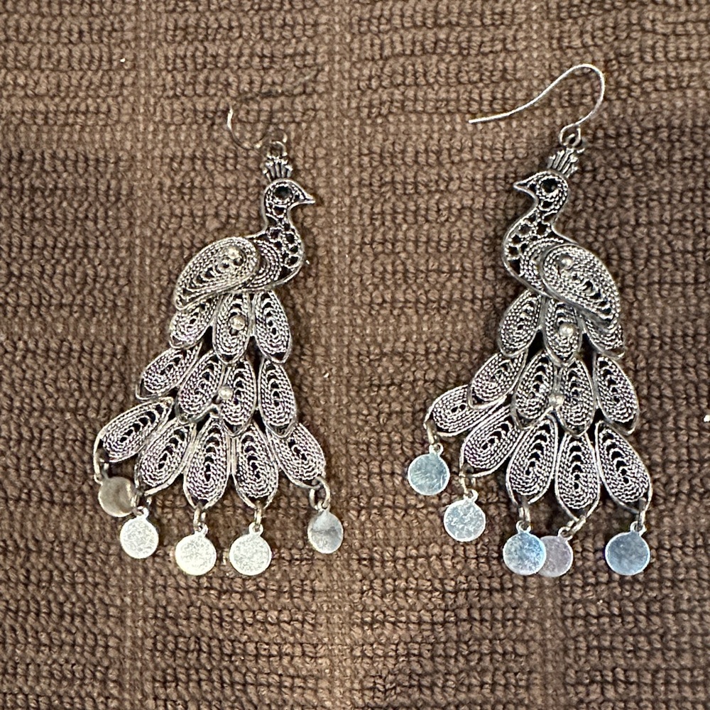 Silver Peacock Dangle Earrings with hinged movement. Onyx eyes.